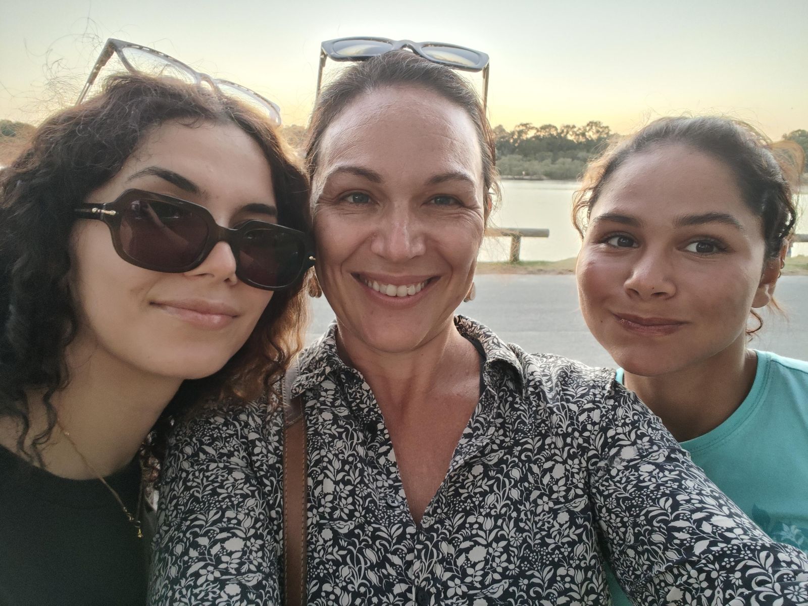 Chelsea takes a selfie of her and her two daughters, all smiling